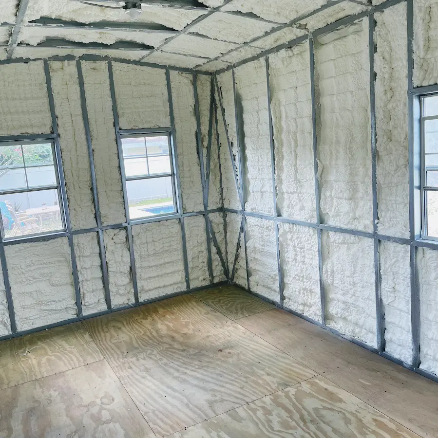 Closed-cell spray foam insulation applied to wall cavities in a residential project in Ionia